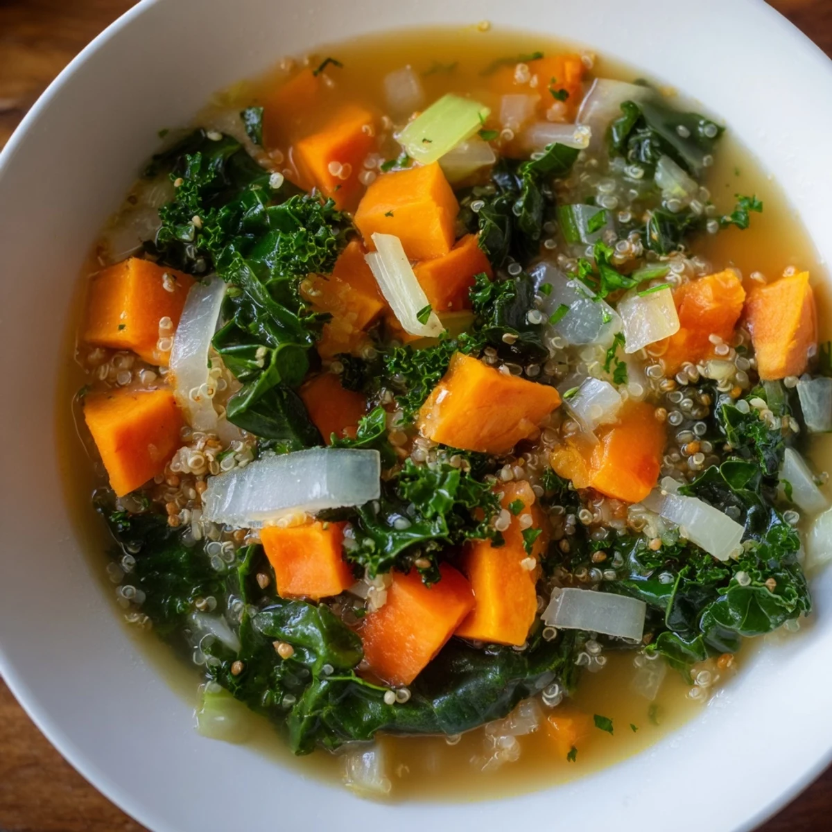 Close-up of a flavorful Winter Veggie Soup brimming with colorful vegetables and fluffy quinoa.