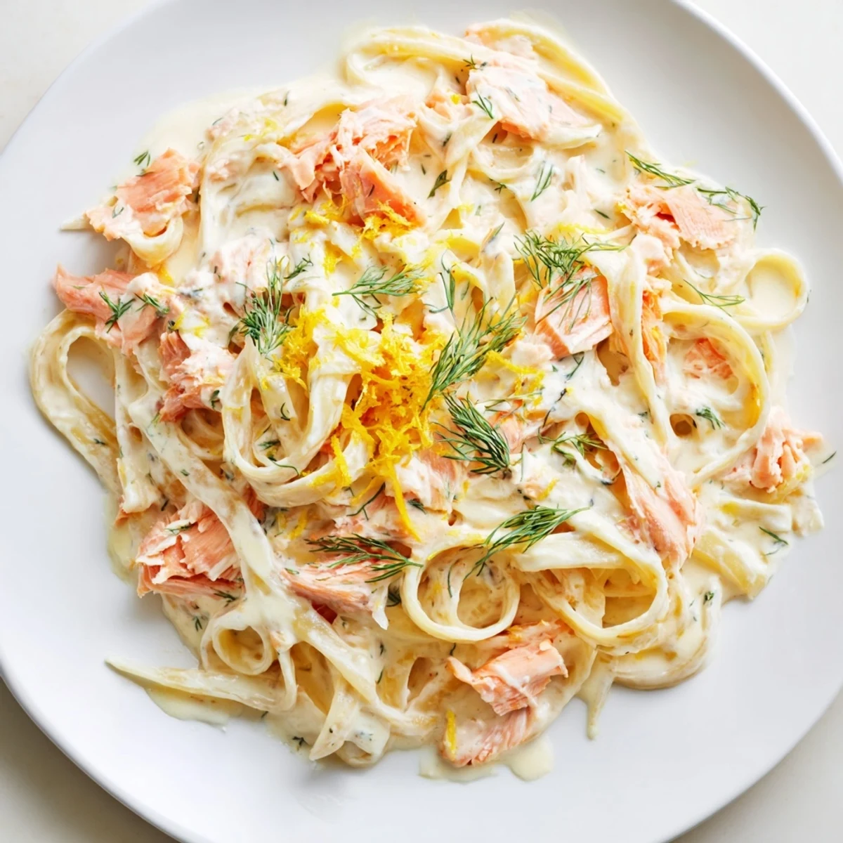 This easy, creamy salmon pasta features silky sauce, lemon zest, and fresh herbs served warm in a skillet.
