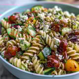 Zesty Italian dressing coats tender pasta and vibrant bell peppers in this refreshing Easy Picnic Pasta Salad, perfect for summer gatherings.