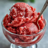 Refreshing watermelon sorbet, showcasing its bright pink hue and naturally sweet flavor.