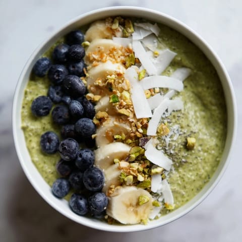 A colorful close-up of chilled matcha overnight oats, ready to be enjoyed with a spoon.