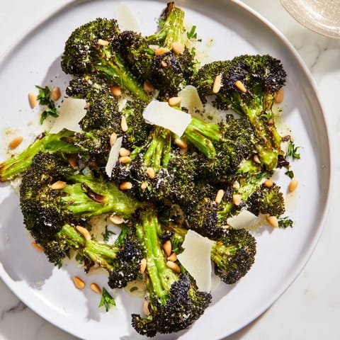 Vibrant charred broccoli salad featuring tender-crisp broccoli, zesty lemon, and nutty Parmesan cheese.