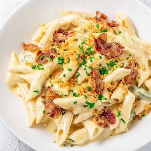 Roasted jalapeños and cheddar sauce coat penne in this easy Jalapeño Popper Pasta dinner.