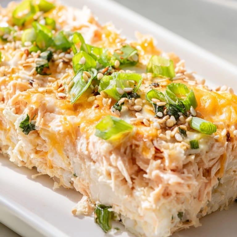 Prepare for a flavorful bite of this Creamy Salmon Sushi Bake with creamy sauce bursting with flavor.